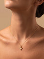 RITI delicate gold ballerina necklace with a fan-shaped skirt and intricate engravings. Minimalist pendant.