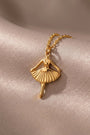 RITI gold-tone ballerina pendant necklace with delicate fan-shaped skirt and fine chain. Minimalist jewelry.